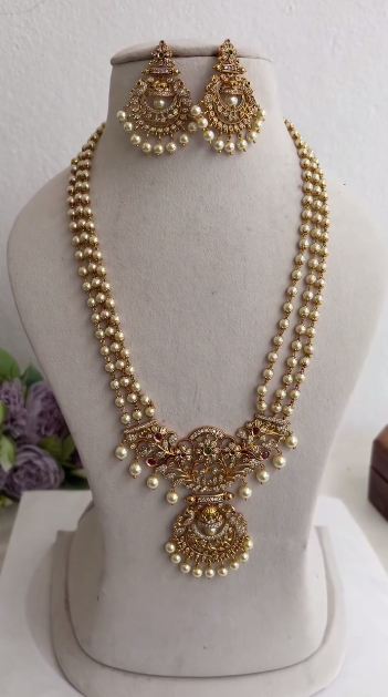 Elegant Three Layer Pearl Necklace with Floral Motif Pendant Drop